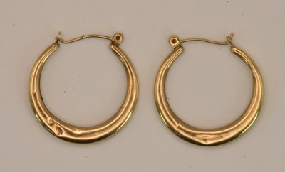 Lot 1511 - A pair of 9ct yellow gold hoop earrings,...