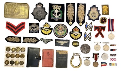 Lot 515 - A quantity of assorted militaria and military...