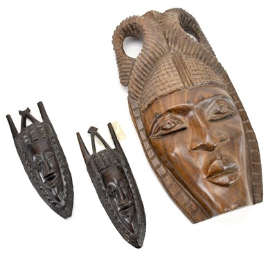 Lot 1659 - A West African carved hardwood tribal mask,...