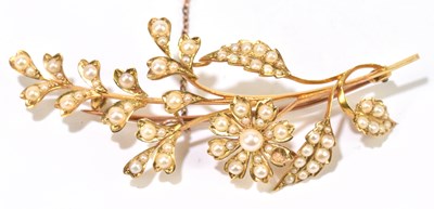 Lot 1214 - A late Victorian yellow metal seed pearl floral brooch
