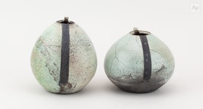 Lot 697 - Two raku vessels with cut rims covered in...