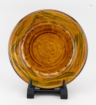 Lot 146 - CLIVE BOWEN (born 1943); a slipware charger...