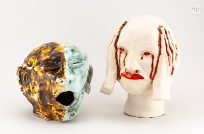 Lot 698 - Two stoneware sculptures of heads, taller 28cm...
