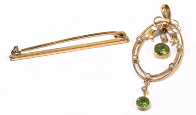 Lot 1235 - An Edwardian yellow metal peridot and seed pearl pendant