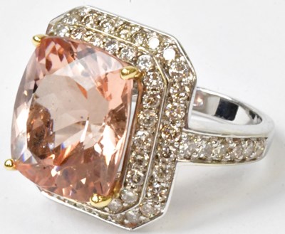 Lot 757 - A 14ct white gold ring set with a peach/pink...