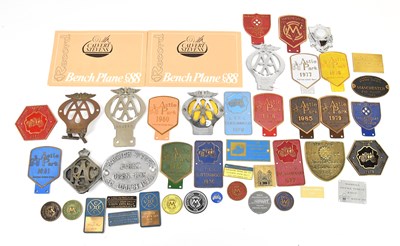 Lot 297 - A collection of car badges including two AA...