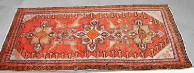 Lot 179 - A decorative runner decorated with stylised...