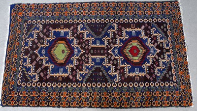 Lot 180 - A decorative Eastern rug, with stylised design...