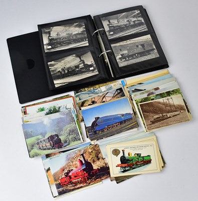 Lot 667 - A postcard album with over one hundred...