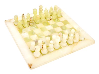 Lot 371 - A cased onyx chess set, height of king 6.5cm.