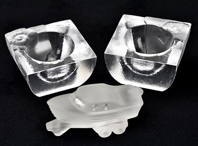 Lot 1469 - KOSTA BODA; a pair of glass tealight holders,...