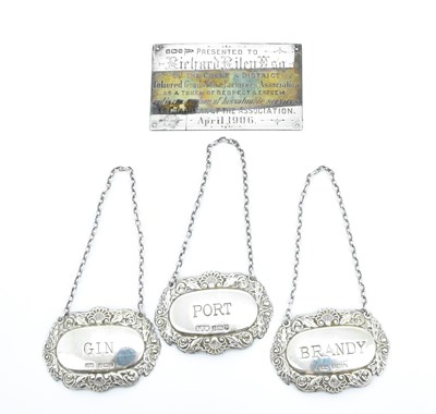 Lot 697 - Three hallmarked silver decanter labels of the...