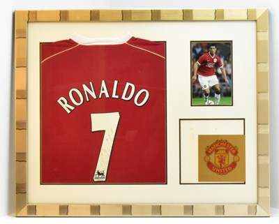 Lot 769 - RONALDO; a framed display comprising a Ronaldo...
