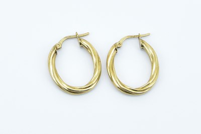 Lot 817 - A pair of 9ct yellow gold twisted hoop...