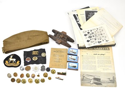 Lot 1217 - A small collection of military badges and...
