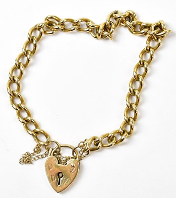 Lot 776 - A 9ct yellow gold curb link bracelet with...