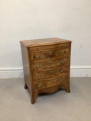 Lot 78 - A reproduction walnut serpentine chest with...