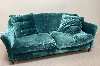 Lot 36 - A contemporary two seater sofa with blue...