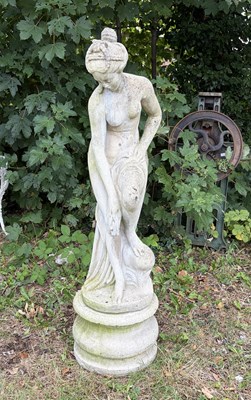 Lot 174 - A reconstituted stone garden statue of a...