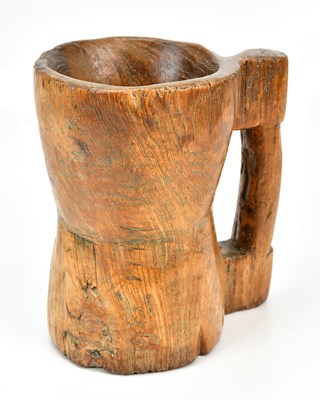 Lot 337 - An Irish vernacular carved wood Lamhog, with...