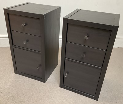 Lot 40 - Two modern black cabinets with two drawers and...