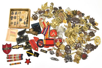 Lot 1169 - A collection of military cap badges including...