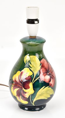 Lot 1363 - MOORCROFT; a 'Hibiscus' pattern table lamp,...