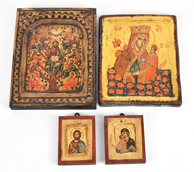 Lot 339 - A group of four painted religious icons,...