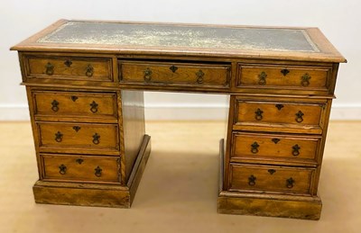 Lot 666 - A Victorian twin pedestal desk with leather...