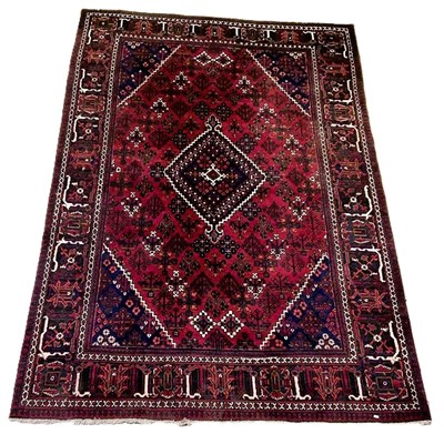 Lot 682 - A hand woven Eastern rug, with central diamond...