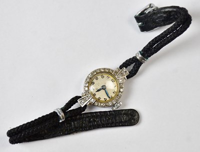 Lot 855 - An Art Deco platinum cocktail watch set with...