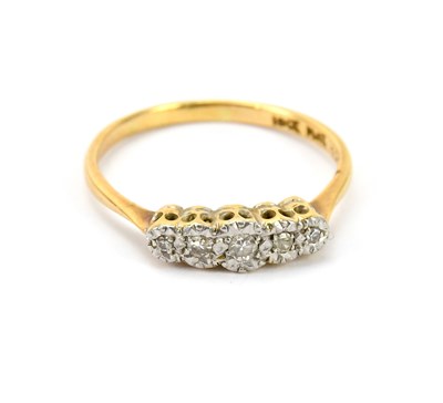 Lot 573 - An 18ct gold and platinum five stone diamond...