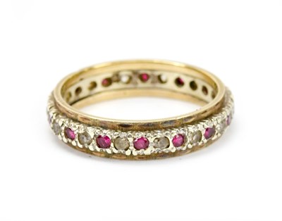 Lot 580 - A 9ct gold and silver wedding band, set with...