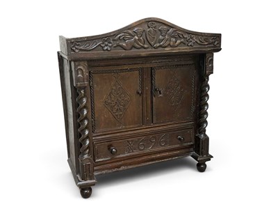 Lot 50 - A 17th century and later carved oak cupboard...
