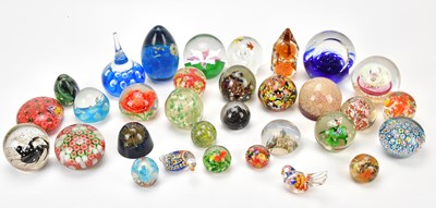 Lot 1474 - An extensive collection of paperweights...