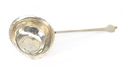 Lot 556 - A white metal brandy warmer, with a 1787...