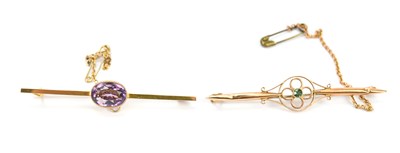 Lot 596 - A yellow metal amethyst set brooch, testing as...