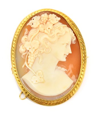 Lot 595 - A yellow metal cameo brooch, carved in relief...