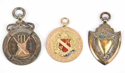 Lot 583 - A yellow metal and enamel sporting medal,...