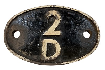 Lot 522A - A black and white painted cast iron oval...
