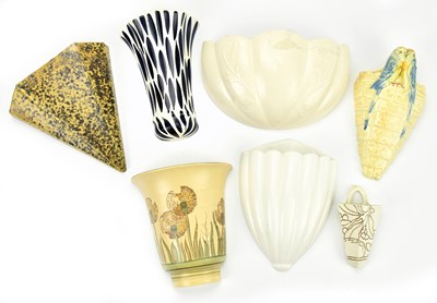 Lot 1358 - A collection of wall pockets, including Arthur...