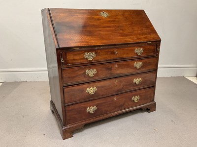 Lot 117 - A George III mahogany bureau, the fall front...