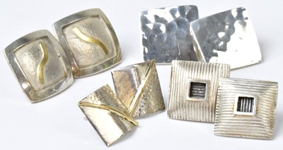 Lot 814 - Four pairs of silver square stud earrings,...