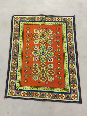 Lot 686 - A handwoven rug with geometric pattern and...