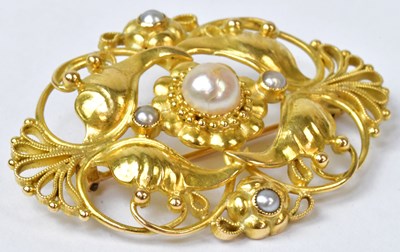 Lot 793 - An 18ct yellow gold foliate and floral brooch...