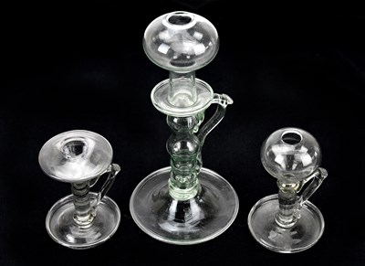 Lot 1442 - Three 19th century glass lace maker's lamps,...