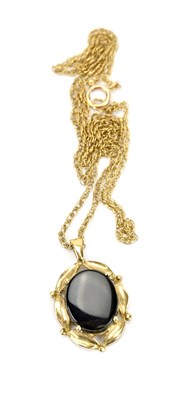 Lot 589 - A 9ct yellow gold chain, with a 9ct yellow...