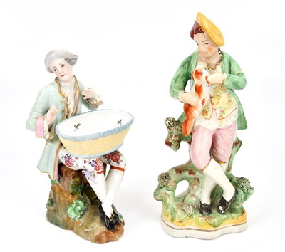 Lot 1283 - A Continental porcelain figure of seated man...