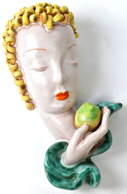 Lot 148 - GOLDSCHEIDER; a ceramic wall mask depicting a...