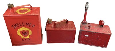Lot 440 - Three assorted vintage painted tinplate oil...